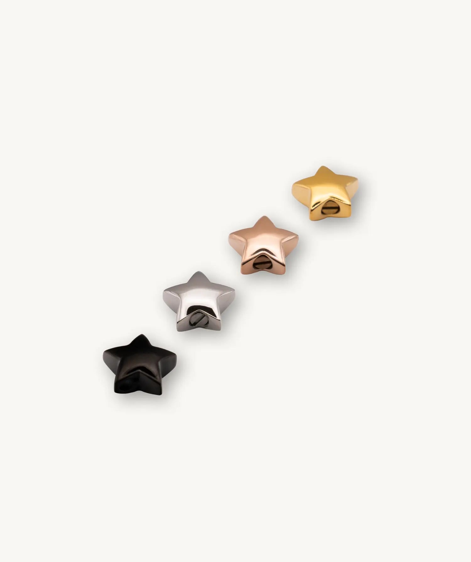 Vier verschiedene Farben des Stern Hellas: schwarz, silber, rosegold, gold